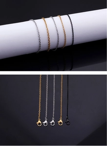 Detailed view of stainless steel O-chains with lobster clasps in gold silver and black