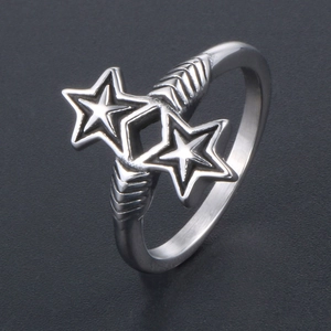 Retro stainless steel ring with double star design and arrow pattern on gray background