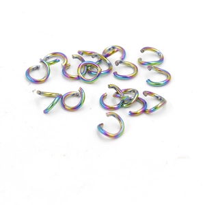 Detailed view of rainbow gradient vacuum plated stainless steel open jump rings for DIY jewelry
