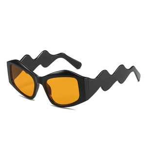 Irregular fashion sunglasses with wavy temples and vibrant orange lenses for a Y2K look