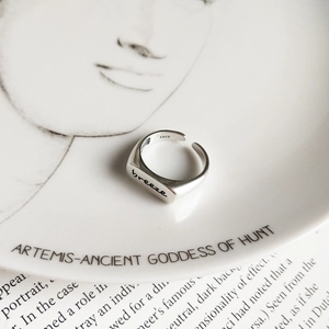 Macro shot of S925 sterling silver ring with breeze engraving and vintage matte finish