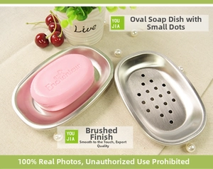 Macro detail of oval stainless steel soap dish with drainage holes and brushed finish