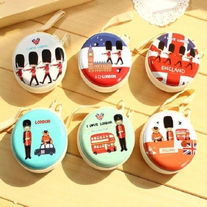 Detailed set of round tinplate coin purses featuring London landmarks and Union Jack prints