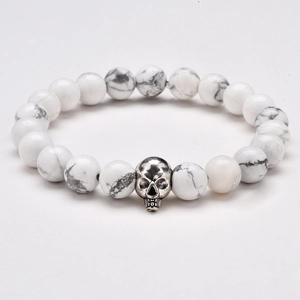 8mm white turquoise beaded bracelet with a silver skull charm on a clean white background