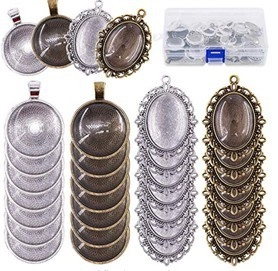 Close-up of DIY jewelry kit with bronze and silver hollow olive branch pendants and glass gems