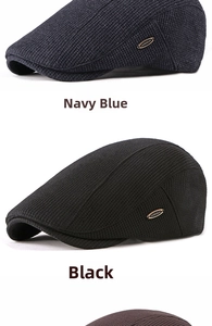 Detail of navy blue and black knit flat caps with vintage side metal logo branding