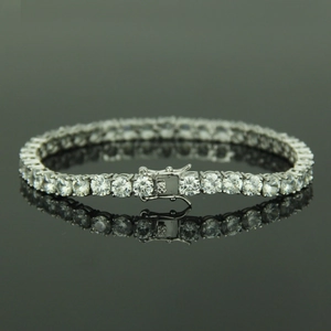 Single row 5mm silver tennis bracelet with zircon stones on black reflective surface