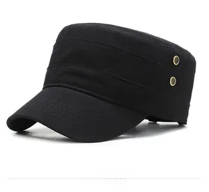 Detail of black cotton cadet cap featuring a shield metal badge and breathable eyelets