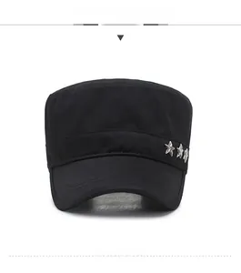 Detail of a black flat top military cap with three silver star studs on the side