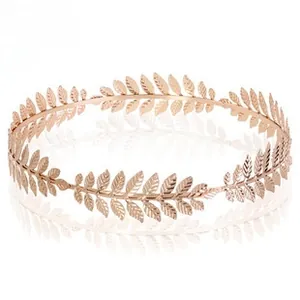 Detail of rose gold leaf tiara with polished metallic finish and intricate textures