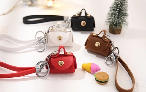 Mini PU leather key pouch with wrist strap and gold snap button in four varied colors