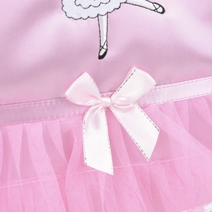 Close-up of pink satin ballet dress featuring ribbon bow and ballerina girl embroidery