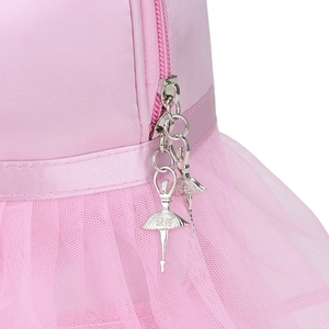 Detailed macro view of pink ballet bag featuring mesh tutu fabric and dancer zipper pulls