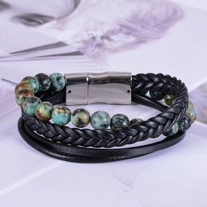 Detail view of multi-layer leather bracelet with green natural stones and silver magnetic clasp