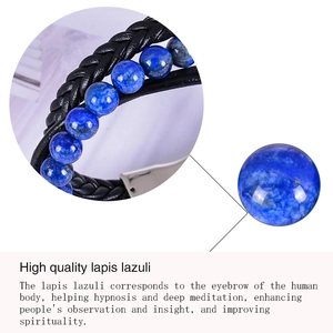 Macro detail of natural lapis lazuli beads and black braided leather strap texture