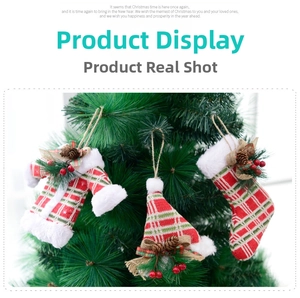 Detail of red and green plaid plush Christmas tree ornaments with pine cones and berries
