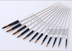 Detail of 12 pearl white watercolor brushes with pointed nylon tips and black ferrules