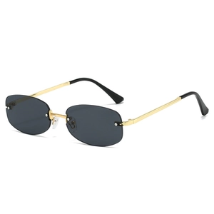 Y2K rimless oval sunglasses with grey lenses and gold metal frame on white background