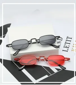 Close-up of retro square sunglasses featuring metal frames and textured temples on props