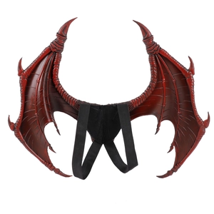 Detailed view of red dragon wings with realistic scale texture and black elastic straps