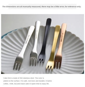 Detailed view of five multi-colored 304 stainless steel dessert forks on a ceramic plate