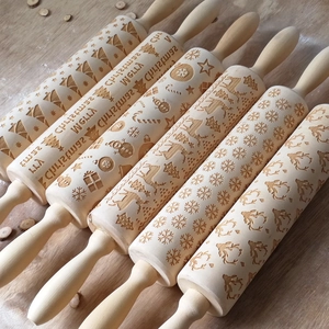Detailed laser-engraved Christmas patterns on wooden rolling pins with festive designs