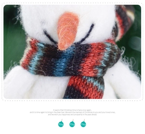 Close-up of wool felt snowman with a colorful knitted scarf for Christmas decor