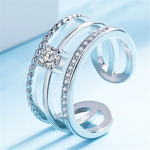 Macro shot of silver triple-layered adjustable ring with sparkling cubic zirconia stones
