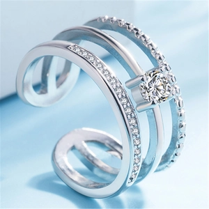 Macro shot of triple-layer silver adjustable ring with crystal pavé and round center stone