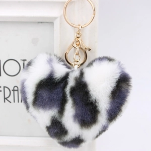 Detail of a leopard print heart faux fur keychain with gold lobster clasp and metal ring