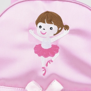 Close-up of pink satin ballet bag featuring intricate embroidery of a dancing ballerina