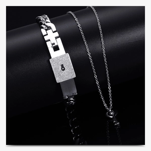 Silver couples jewelry set with heart lock bracelet and key pendant necklace detail