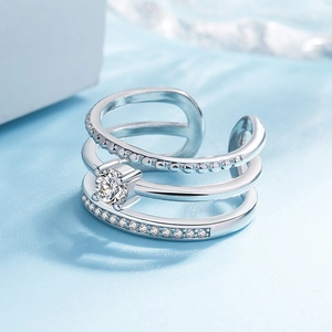 Detailed close-up of a silver three-layer adjustable ring with sparkling round zircons