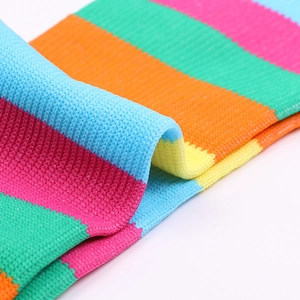 Mid-calf athletic socks featuring colorful rainbow stripes and breathable knit texture
