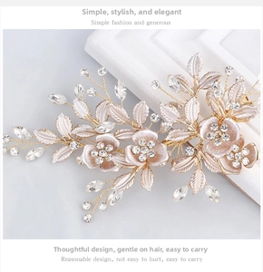 Macro shot of handmade gold leaf hair clip with crystal flowers for bridal wedding hair
