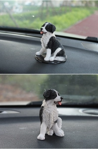 Detailed realistic black and white Border Collie resin dog ornament for car dashboard
