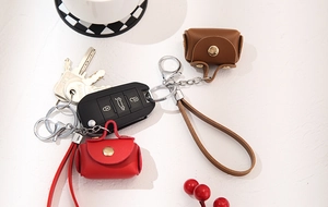 Mini leather coin purses in red and brown with litchi texture and metal lobster clasps