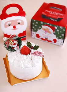Detail of red Santa Claus candy gift boxes with festive Merry Christmas illustrations