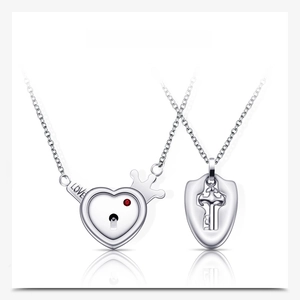 Polished stainless steel couple necklaces featuring a heart lock with a red gem and key