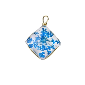 Creative glass pendant with blue dried flowers and gold wire wrap for DIY jewelry