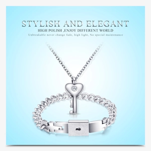 Detailed view of silver heart key necklace and lock bracelet set with cubic zirconia