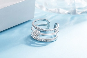 Detail view of silver multi-layer adjustable ring with beads and sparkling cubic zirconia