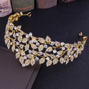 Elegant gold leaf bridal tiara with sparkling rhinestones on a dark display stand