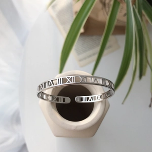 Detailed view of S925 sterling silver cuff bangle with engraved Roman numerals
