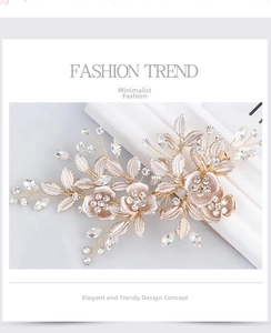 Detail of bridal hair clip with gold metal leaves and sparkling crystal flowers