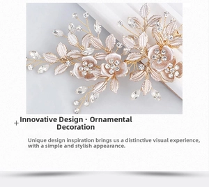 Close-up of a gold bridal hair clip with cream flowers, rhinestones, and leaf crystals
