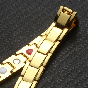 Macro shot of gold-plated healthcare bracelet showing inner magnetic therapy elements
