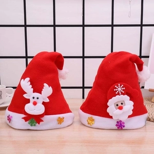Detail of Christmas hats featuring Reindeer and Santa Claus designs with plush white trim