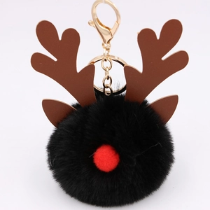 Christmas reindeer plush pompom keychain in black with red nose and brown antlers