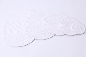 Set of 5 white handwoven cotton heat-resistant coasters in round and oval shapes